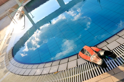 Scuba on the edge of outdoor pool photo