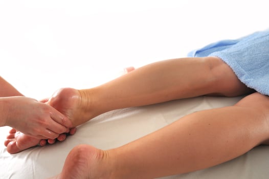 foot and leg massage at the spa and wellness center photo