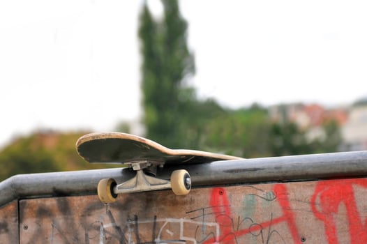 Skate board left behind in park photo