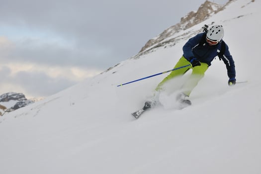 skiing on fresh snow at winter season at beautiful sunny day photo