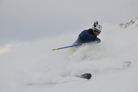 skiing on fresh snow at winter season at beautiful sunny day photo