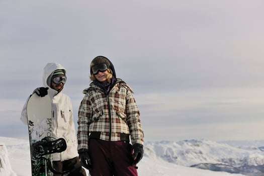 snowboarder's couple on mountain's top photo