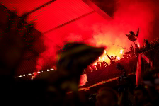 football hooligans with mask holding torches in fire photo