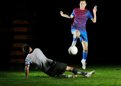 football players in competition for the ball photo