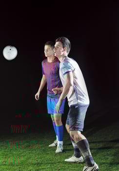football players in competition for the ball photo