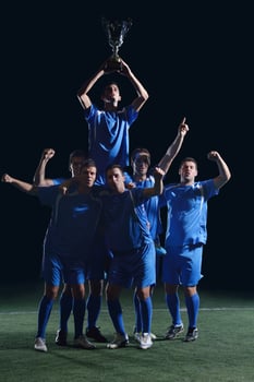 soccer players celebrating victory photo