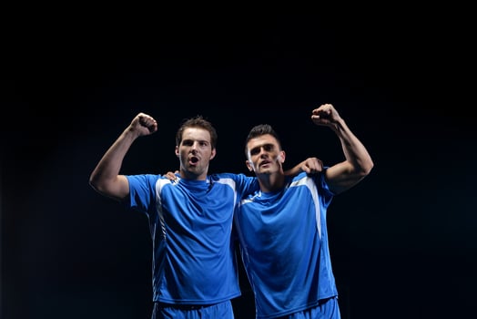 soccer players celebrating victory photo