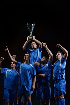 soccer players celebrating victory photo