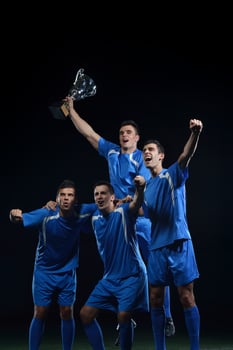 soccer players celebrating victory photo
