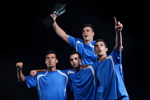 soccer players celebrating victory photo