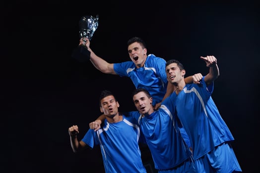 soccer players celebrating victory photo