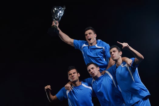 soccer players celebrating victory photo