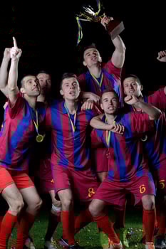 soccer players celebrating victory photo