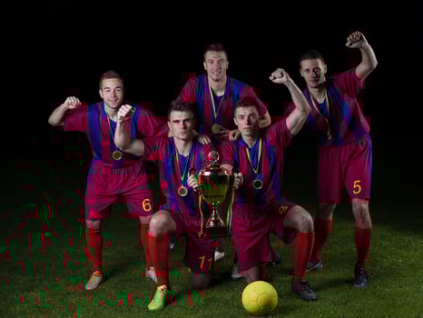 soccer players celebrating victory photo