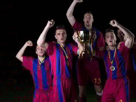 soccer players celebrating victory photo