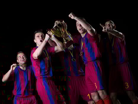 soccer players celebrating victory photo