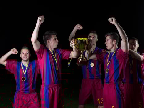 soccer players celebrating victory photo