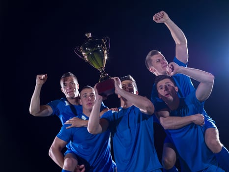 soccer players celebrating victory photo