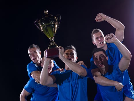 soccer players celebrating victory photo