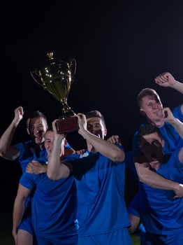 soccer players celebrating victory photo