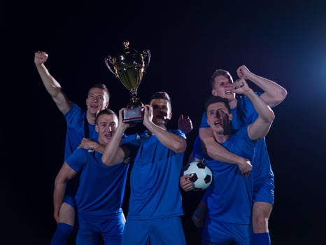 soccer players celebrating victory photo