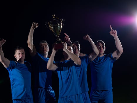 soccer players celebrating victory photo