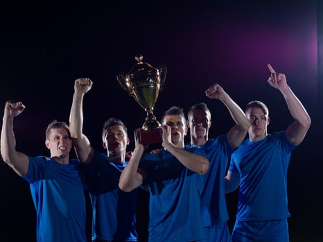 soccer players celebrating victory photo