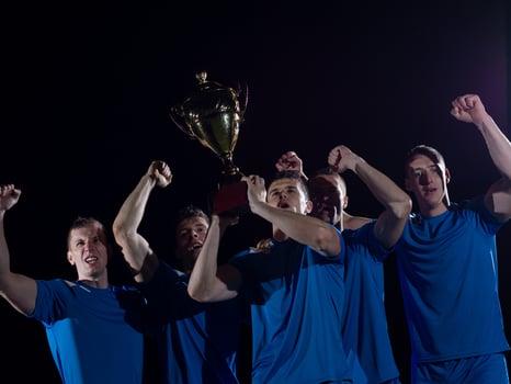 soccer players celebrating victory photo