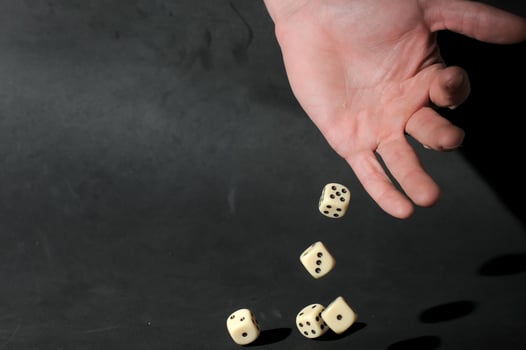 Hand throwing Dice photo
