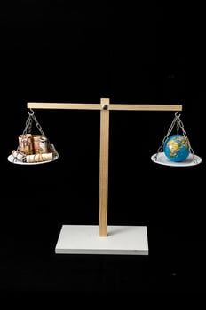 Earth and Money on a Two Pan Balance photo