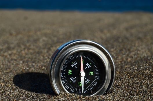 Tourist Compass in the Sand photo