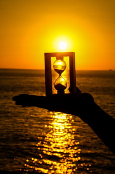 Hourglass in hand photo