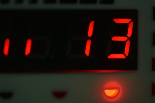 The number 13 on the electronic clock display photo