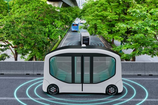 Autonomous electric shuttle bus self driving across city green road, Smart vehicle concept photo