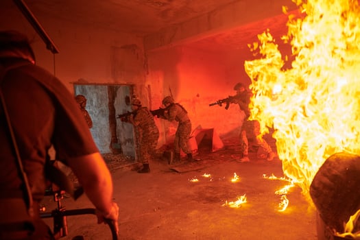 Videographer Taking Action Shoot of Soldiers in Action urban environment photo