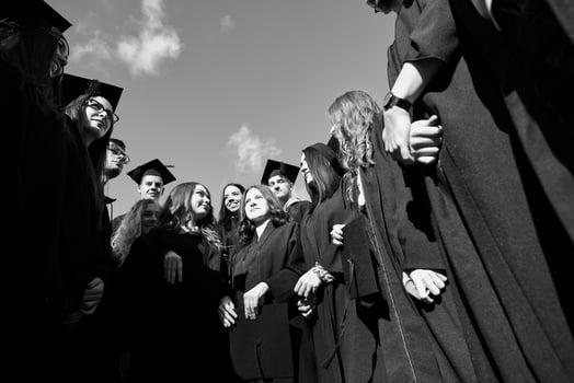 Group of diverse international graduating students celebrating photo