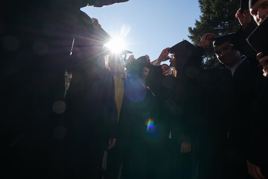 Group of diverse international graduating students celebrating photo