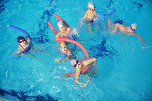 happy children group  at swimming pool photo