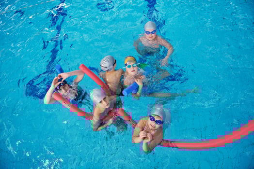 happy children group  at swimming pool photo