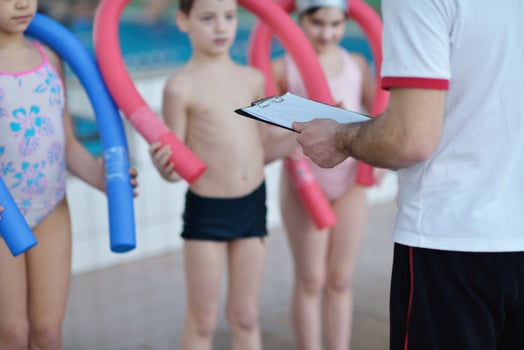 happy children group  at swimming pool photo
