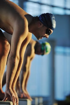 young swimmmer on swimming start photo