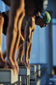 young swimmmer on swimming start photo