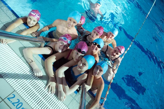 happy children group  at swimming pool photo