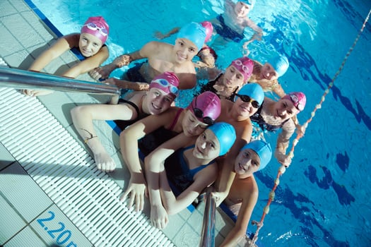 happy children group  at swimming pool photo