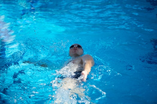 swimmer excercise on indoor swimming poo photo