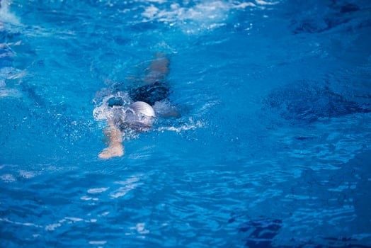 swimmer excercise on indoor swimming poo photo