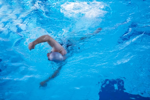 swimmer excercise on indoor swimming poo photo