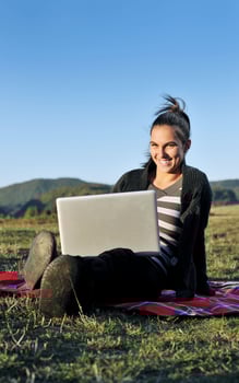 young teen girl work on laptop outdoor photo