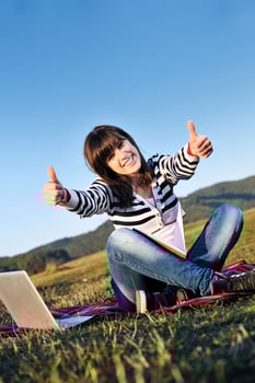 young teen girl work on laptop outdoor photo