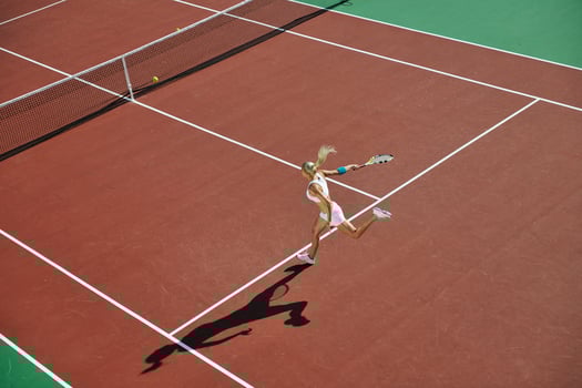 young woman play tennis outdoor photo